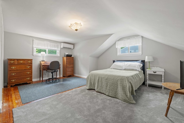 376 Glenwood Avenue Extension, Waterford, CT 06385 - bedroom featuring a wall mounted air conditioner, multiple windows, lofted ceiling, and wood finished floors