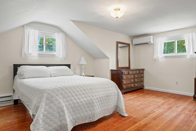 376 Glenwood Avenue Extension, Waterford, CT 06385 - bedroom with a wall mounted AC, wood finished floors, and vaulted ceiling