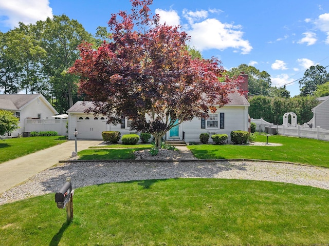 376 Glenwood Avenue Extension, Waterford, CT 06385 - obstructed view of property featuring concrete driveway, an attached garage, entry steps, and a chimney