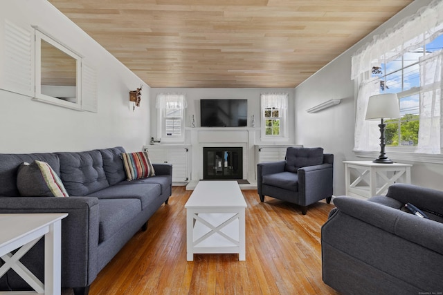 376 Glenwood Avenue Extension, Waterford, CT 06385 - living area with wooden ceiling, plenty of natural light, light wood-style floors, and a glass covered fireplace