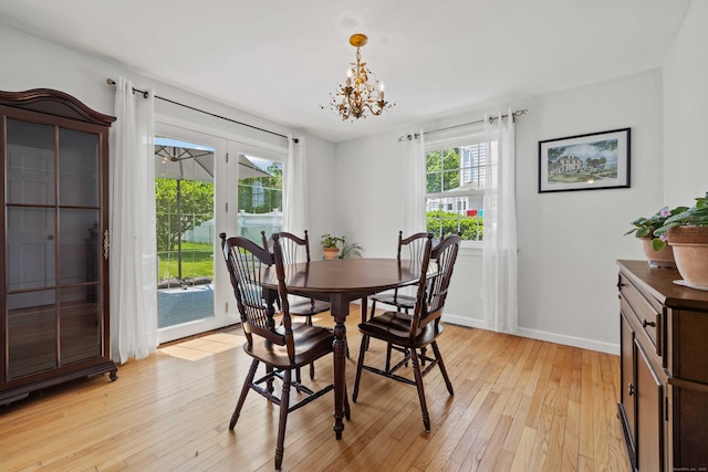 376 Glenwood Avenue Extension, Waterford, CT 06385 - dining space with light wood-style floors, a chandelier, and french doors