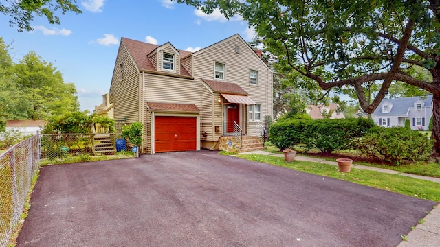 166 Catherine St, Hartford, CT 06106 - view of front of house with driveway, roof with shingles, and a garage