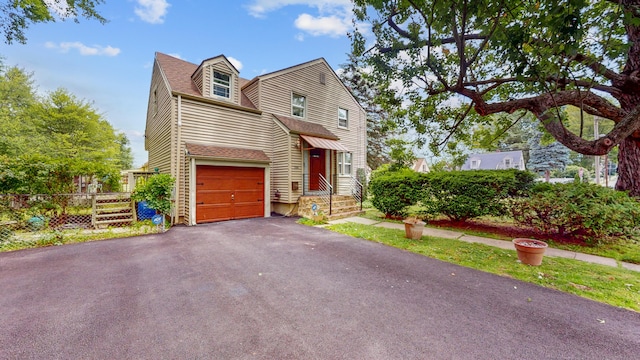 166 Catherine St, Hartford, CT 06106 - view of front facade featuring asphalt driveway, an attached garage, and roof with shingles