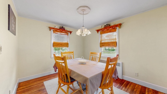 166 Catherine St, Hartford, CT 06106 - dining space with plenty of natural light, a chandelier, and wood finished floors