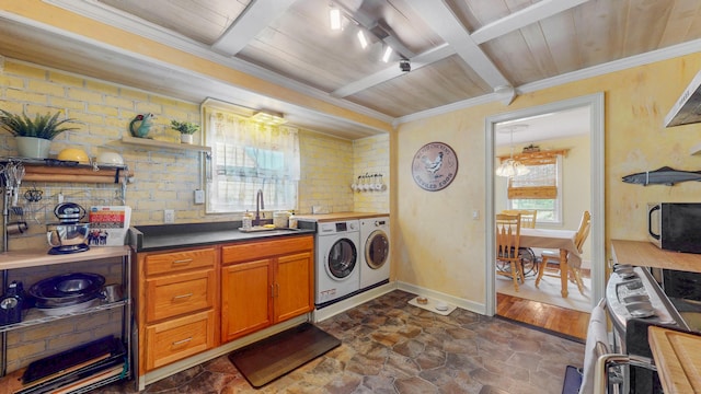 166 Catherine St, Hartford, CT 06106 - laundry room featuring washing machine and dryer, dark stone finish floors, crown molding, and wood ceiling