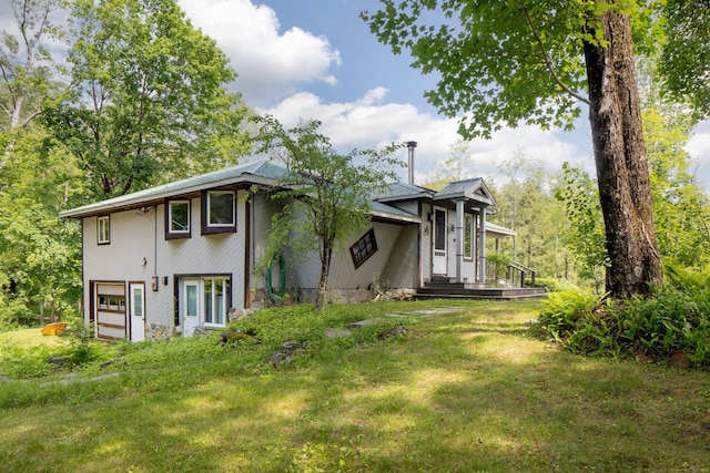 48 Preston Ln, Salisbury, CT 06068 - view of front of property featuring a metal roof, a front yard, and an attached garage