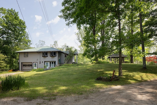 48 Preston Ln, Salisbury, CT 06068 - view of green lawn with a garage, a gazebo, and dirt driveway