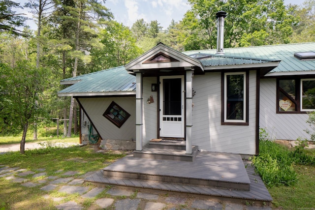 48 Preston Ln, Salisbury, CT 06068 - view of front of property with a metal roof and view of wooded area