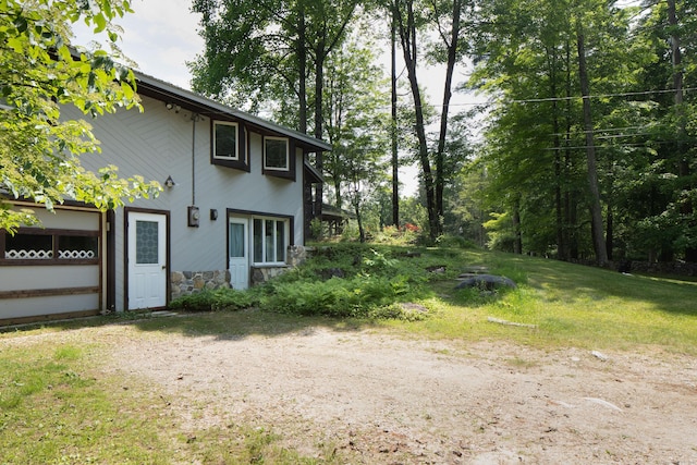 48 Preston Ln, Salisbury, CT 06068 - view of side of home with stone siding and a yard