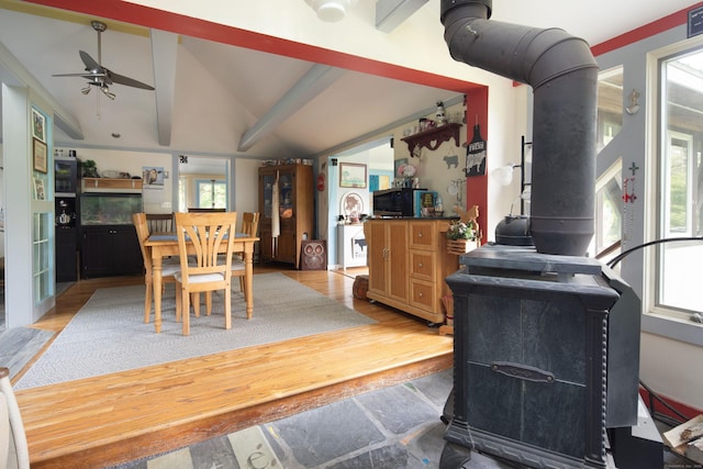 48 Preston Ln, Salisbury, CT 06068 - dining space featuring a wood stove, a ceiling fan, and light wood-style flooring