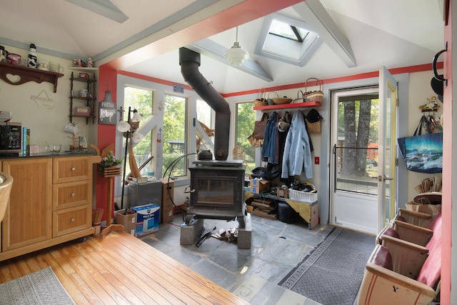 48 Preston Ln, Salisbury, CT 06068 - interior space featuring a wood stove, vaulted ceiling, healthy amount of natural light, a skylight, and light wood-type flooring