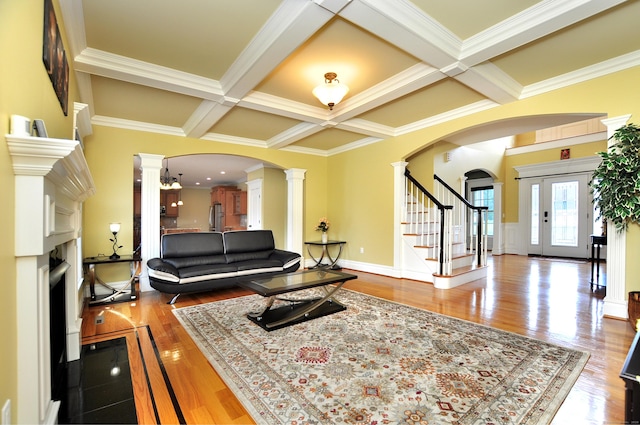 1 Leghorn Ln, Cromwell, CT 06416 - living area featuring ornate columns, coffered ceiling, beamed ceiling, crown molding, and stairs