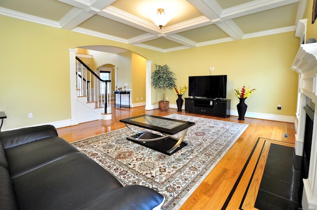 1 Leghorn Ln, Cromwell, CT 06416 - living room with arched walkways, ornate columns, coffered ceiling, a fireplace, and stairway
