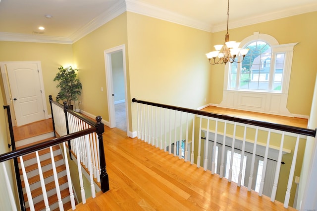 1 Leghorn Ln, Cromwell, CT 06416 - corridor featuring an upstairs landing, a chandelier, ornamental molding, wood finished floors, and recessed lighting