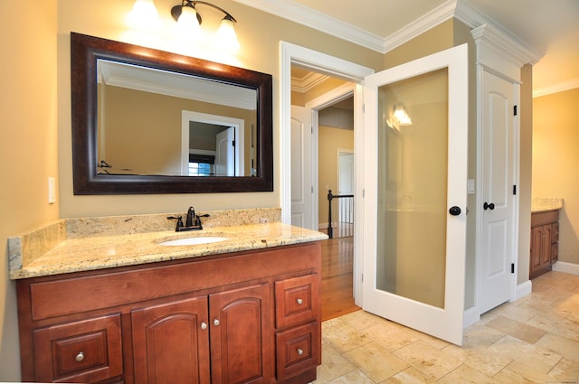 1 Leghorn Ln, Cromwell, CT 06416 - bathroom featuring vanity, ornamental molding, and stone tile flooring