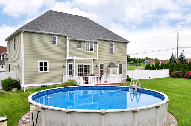 1 Leghorn Ln, Cromwell, CT 06416 - back of property featuring an outdoor pool, roof with shingles, and a deck