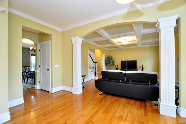 1 Leghorn Ln, Cromwell, CT 06416 - living room featuring light wood-type flooring, arched walkways, ornate columns, stairs, and ornamental molding