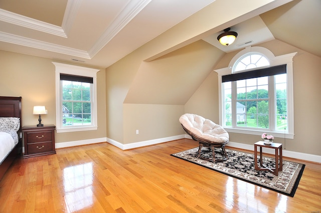 1 Leghorn Ln, Cromwell, CT 06416 - living area featuring healthy amount of natural light, wood finished floors, vaulted ceiling, and ornamental molding