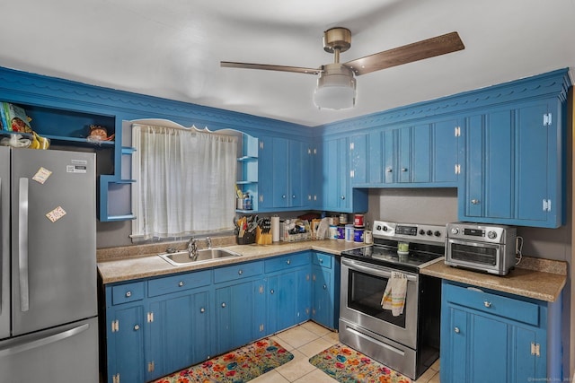 84 Hickory St, West Haven, CT 06516 - kitchen featuring appliances with stainless steel finishes, blue cabinets, light tile patterned floors, and a ceiling fan