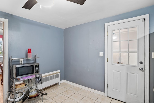 84 Hickory St, West Haven, CT 06516 - foyer with ceiling fan, light tile patterned flooring, and radiator