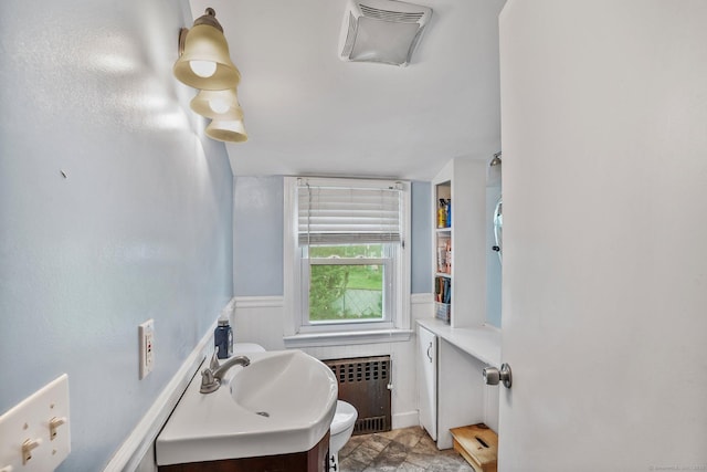84 Hickory St, West Haven, CT 06516 - bathroom featuring radiator heating unit, wainscoting, and vanity