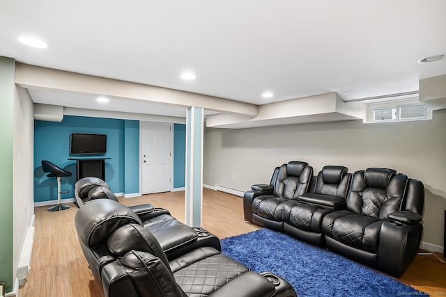 84 Hickory St, West Haven, CT 06516 - home theater room featuring a baseboard heating unit, light wood-style floors, and recessed lighting