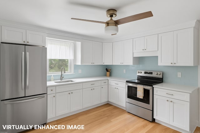 84 Hickory St, West Haven, CT 06516 - kitchen with stainless steel appliances, light countertops, backsplash, and white cabinets