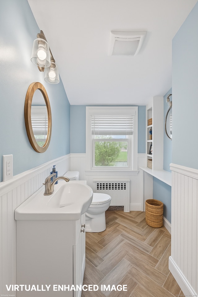 84 Hickory St, West Haven, CT 06516 - bathroom featuring radiator, wainscoting, and vanity