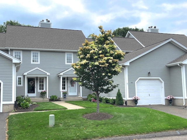 66 Copley Rd Unit 66, Glastonbury, CT 06073 - view of front of home featuring a chimney, a front lawn, a garage, asphalt driveway, and a shingled roof