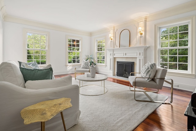 43 Chessor Ln, Wilton, CT 06897 - living room featuring wood finished floors, crown molding, and a fireplace with flush hearth