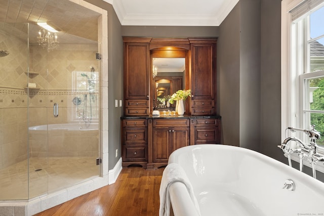 43 Chessor Ln, Wilton, CT 06897 - bathroom featuring a soaking tub, a stall shower, crown molding, wood finished floors, and vanity