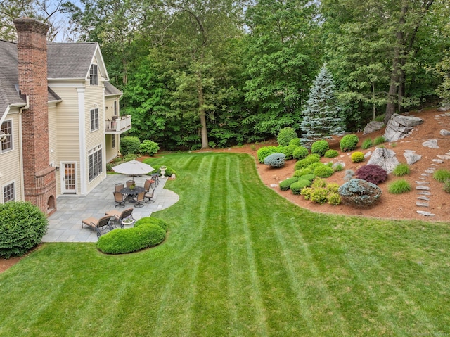 43 Chessor Ln, Wilton, CT 06897 - view of green lawn with a patio area and a balcony