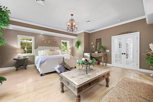 67 Hayden Hill Rd, Haddam, CT 06438 - bedroom with a chandelier, crown molding, french doors, and light wood-style flooring
