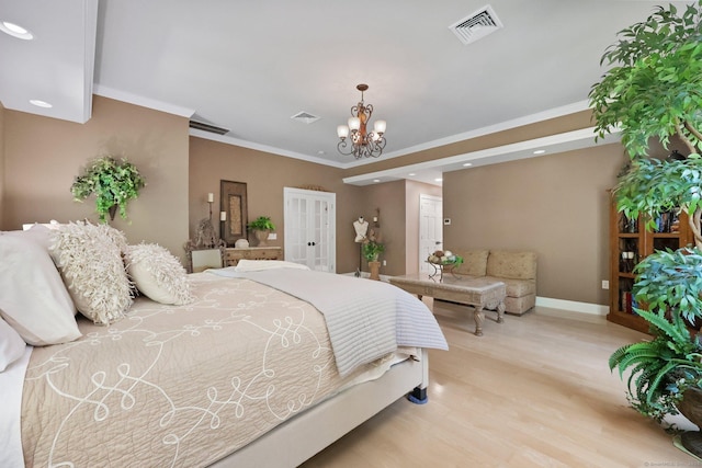 67 Hayden Hill Rd, Haddam, CT 06438 - bedroom featuring french doors, a chandelier, recessed lighting, light wood finished floors, and ornamental molding