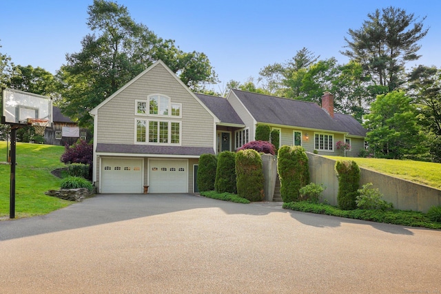 67 Hayden Hill Rd, Haddam, CT 06438 - view of front of home featuring driveway, a garage, a front lawn, and a chimney