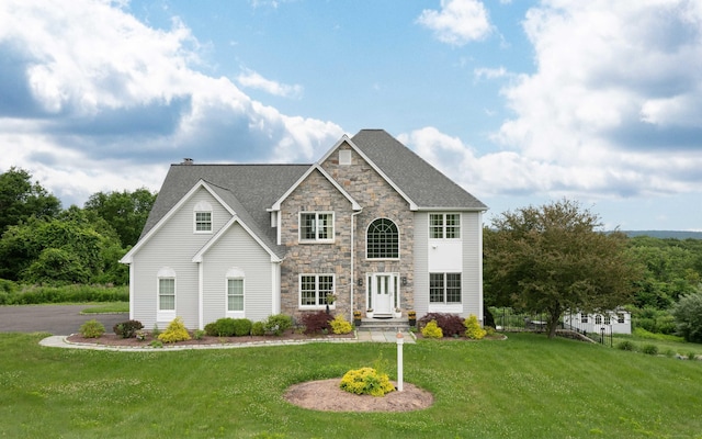 557 Upper Grassy Hill Rd, Woodbury, CT 06798 - view of front of property with a front lawn, stone siding, and a shingled roof
