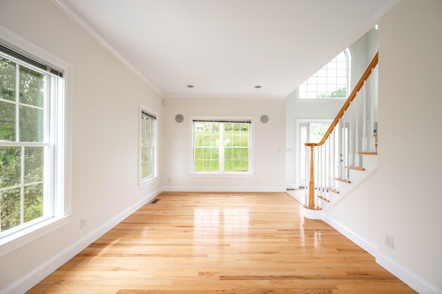 557 Upper Grassy Hill Rd, Woodbury, CT 06798 - foyer entrance with light wood finished floors, stairs, and crown molding