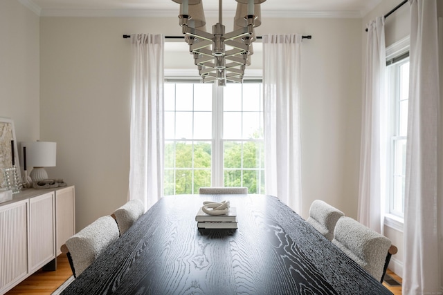 557 Upper Grassy Hill Rd, Woodbury, CT 06798 - dining space with a chandelier, healthy amount of natural light, crown molding, and wood finished floors