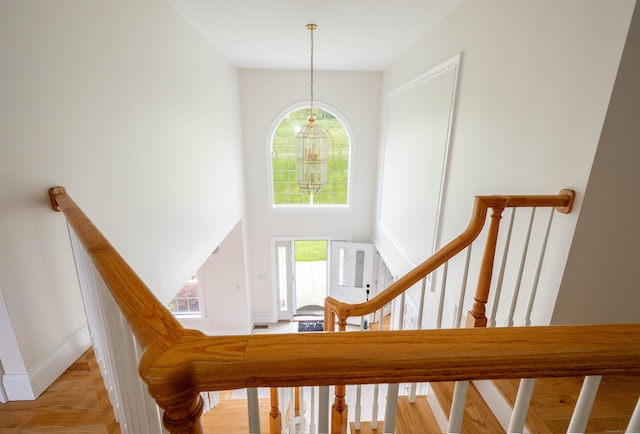 557 Upper Grassy Hill Rd, Woodbury, CT 06798 - stairway featuring a high ceiling and a chandelier