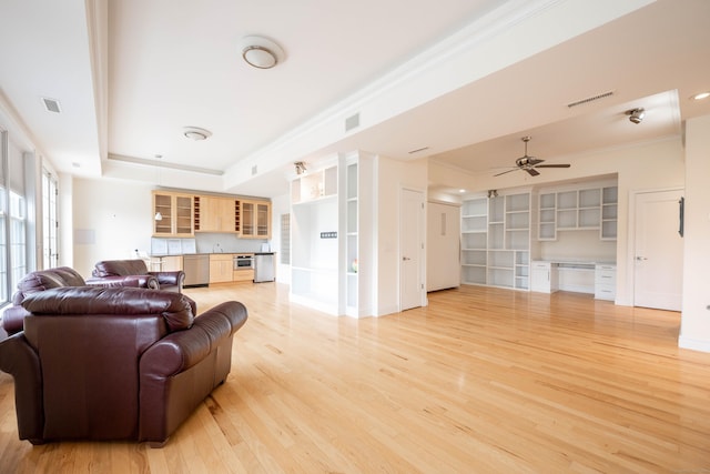 557 Upper Grassy Hill Rd, Woodbury, CT 06798 - living area featuring a tray ceiling, light wood-style floors, ceiling fan, ornamental molding, and built in desk