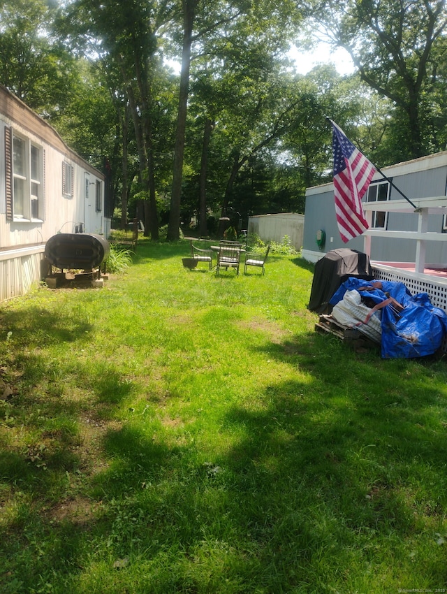 268 Flanders Rd Trlr 20, Groton, CT 06355 - view of green lawn with view of wooded area