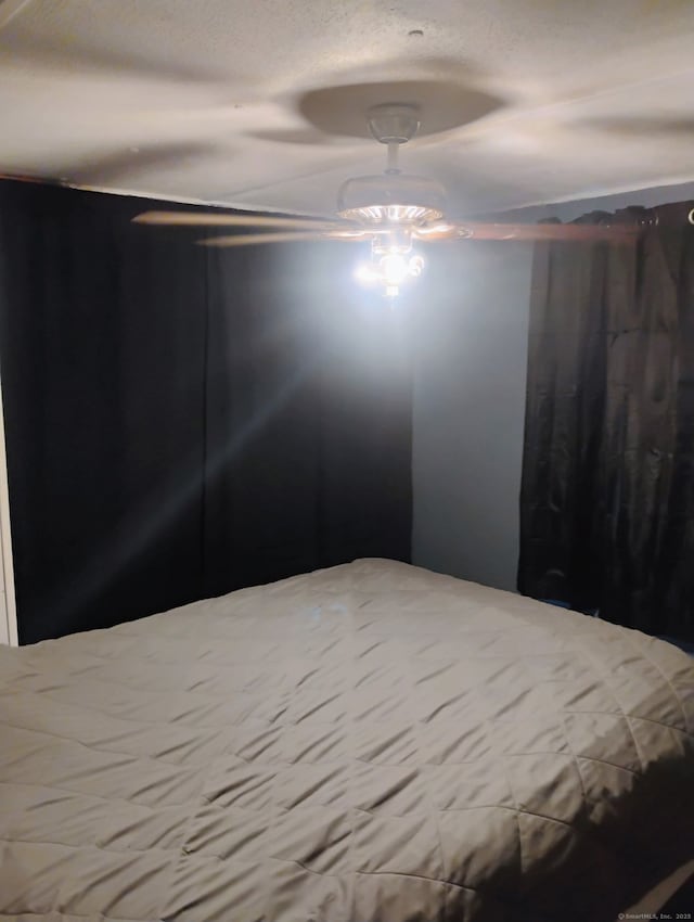 268 Flanders Rd Trlr 20, Groton, CT 06355 - bedroom featuring a textured ceiling and ceiling fan