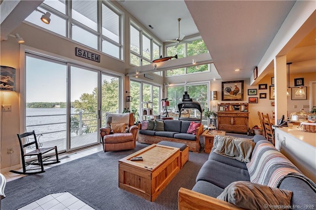 166 Old Colchester Rd, Salem, CT 06420 - living area with ceiling fan, tile patterned floors, a towering ceiling, and a water view