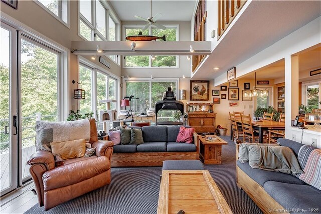 166 Old Colchester Rd, Salem, CT 06420 - living room featuring plenty of natural light, a towering ceiling, and carpet