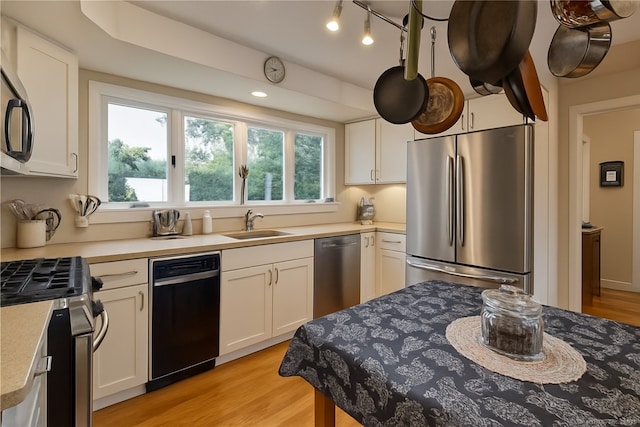 166 Old Colchester Rd, Salem, CT 06420 - kitchen featuring appliances with stainless steel finishes, light countertops, and white cabinets