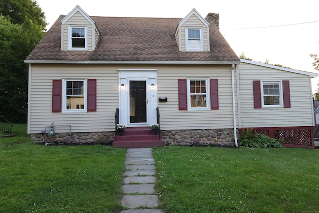 57 Grace Ave, Waterbury, CT 06710 - cape cod home with a front yard, a chimney, and a shingled roof