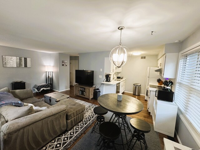 21 Prospect Ave Unit A101, Norwalk, CT 06850 - living room featuring dark wood-type flooring and baseboards