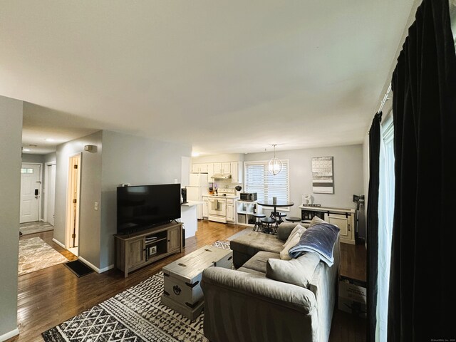 21 Prospect Ave Unit A101, Norwalk, CT 06850 - living area with dark wood-type flooring and baseboards