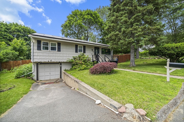 8 Cornfield Rd, Waterbury, CT 06704 - ranch-style house featuring solar panels, a garage, and asphalt driveway