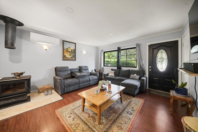 8 Cornfield Rd, Waterbury, CT 06704 - living room with a wall mounted AC, a wood stove, wood finished floors, and crown molding
